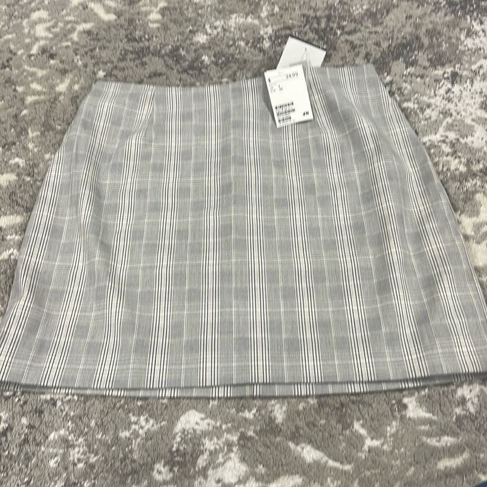 Brand new Grey with white stripes.